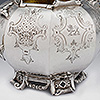 Two decorative engraved panels to sugar bowl with lion crest