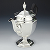 Front of teapot with octagonal features, ornate spout with silver knop